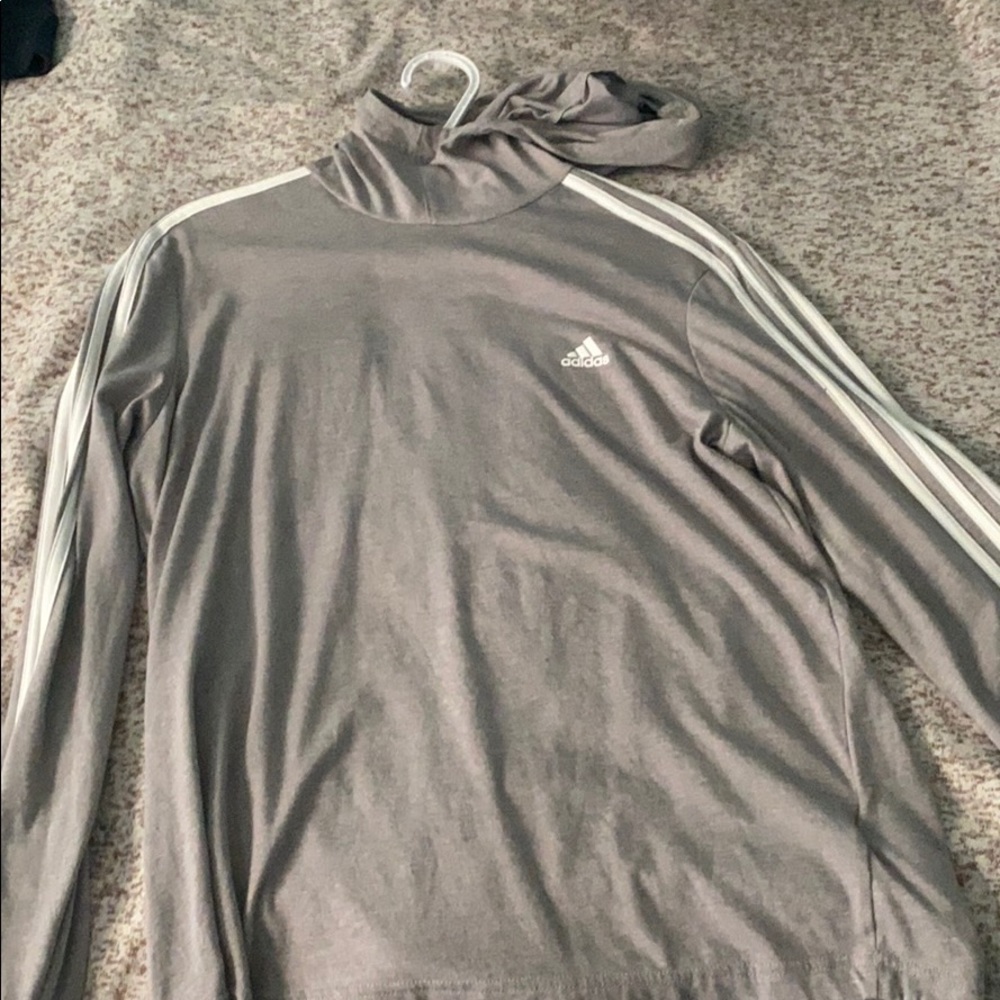 a grey light Adidas sweater